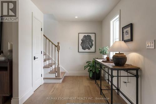 Foyer with powder room and front hall closet. - 890 Forest Glen Avenue, Burlington, ON 