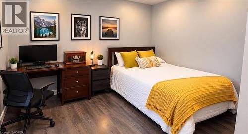 Bedroom featuring wood-finish flooring and recessed ceiling lighting - 1394 Cannon Street E, Hamilton, ON 