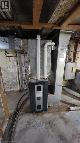 High-efficiency Trane HVAC furnace unit with attached galvanized metal ductwork and PVC venting - 1394 Cannon Street E, Hamilton, ON 