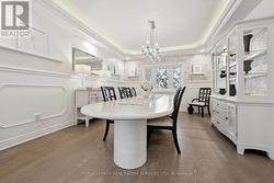 The Elegant Dining Room Boasts a Coffered Ceiling - 