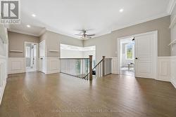 Hardwood Flooring Flows Throughout Upper Hallway - 