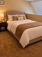 AI Photo of loft bedroom -Neutral carpeting and angled ceiling lines - 