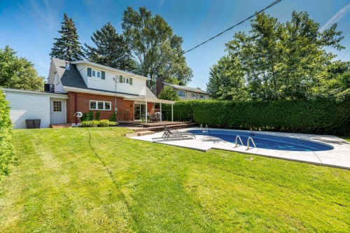 Courtyard - 8 Av. Hébert, Candiac, QC - Outdoor With In Ground Pool With Backyard
