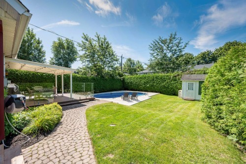 Courtyard - 8 Av. Hébert, Candiac, QC - Outdoor With In Ground Pool With Backyard