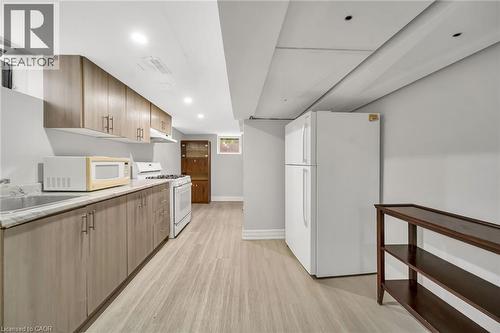 Kitchenette featuring wood-finish cabinetry, light-toned countertops, and recessed lighting - 284 Cedar Crescent, Cambridge, ON - Indoor Photo Showing Kitchen