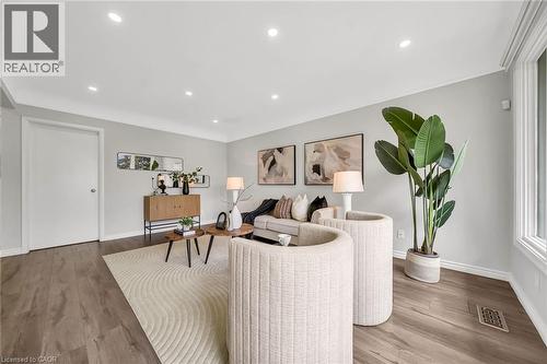 Recessed lighting, wood-finish flooring, light grey wall paint, and large windows - 284 Cedar Crescent, Cambridge, ON - Indoor