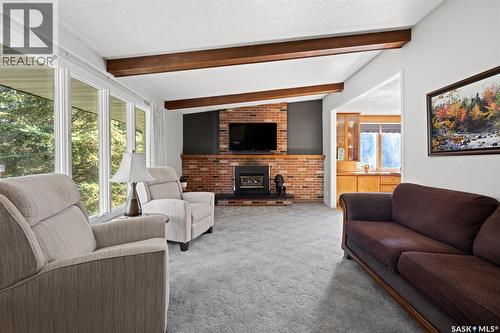 23 Ridgedale Bay, White City, SK - Indoor Photo Showing Living Room With Fireplace