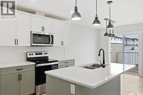 713 Brighton Boulevard, Saskatoon, SK - Indoor Photo Showing Kitchen With Double Sink With Upgraded Kitchen