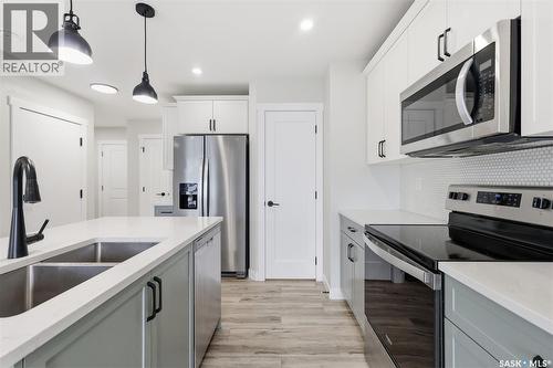 713 Brighton Boulevard, Saskatoon, SK - Indoor Photo Showing Kitchen With Double Sink With Upgraded Kitchen