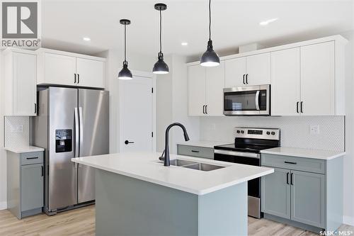713 Brighton Boulevard, Saskatoon, SK - Indoor Photo Showing Kitchen With Double Sink With Upgraded Kitchen