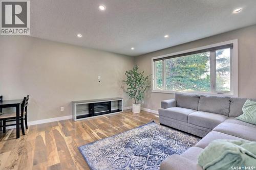 6918 1St Avenue N, Regina, SK - Indoor Photo Showing Living Room With Fireplace