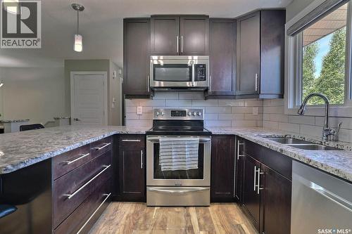6918 1St Avenue N, Regina, SK - Indoor Photo Showing Kitchen With Stainless Steel Kitchen With Double Sink With Upgraded Kitchen