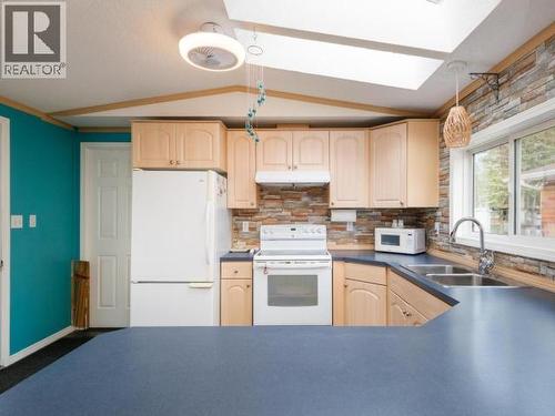 225-989 Range Road, Whitehorse, YT - Indoor Photo Showing Kitchen With Double Sink