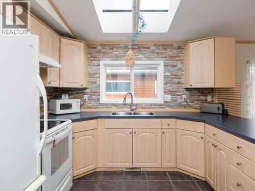 225-989 Range Road, Whitehorse, YT - Indoor Photo Showing Kitchen With Double Sink