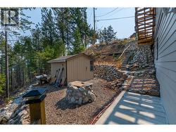 lower level has a storage shed and a fire pit - 
