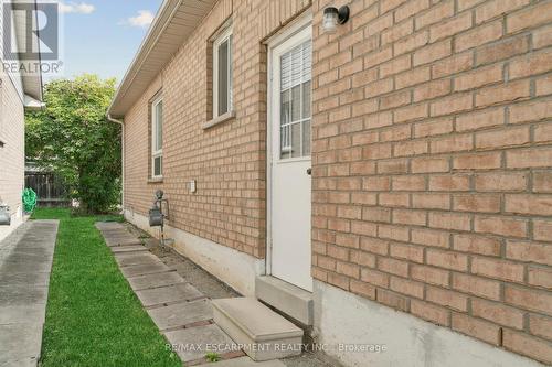 Side door from garage and walkway to backyard - 245 Centennial Forest Drive, Milton, ON - Outdoor With Exterior