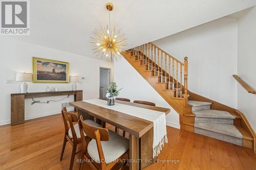 Dining area and stairs to loft - 245 Centennial Forest Drive, Milton, ON - Indoor Photo Showing Other Room