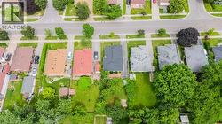 Aerial perspective showcasing a residential street with multiple single-family homes - 