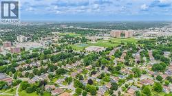 Expansive aerial perspective showcasing a residential area with mature tree coverage - 