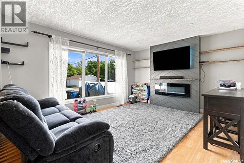 130 6Th Street, Pilot Butte, SK - Indoor Photo Showing Living Room With Fireplace