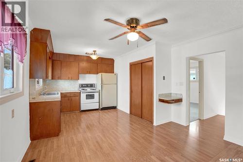 209 Broad Street N, Regina, SK - Indoor Photo Showing Kitchen With Double Sink
