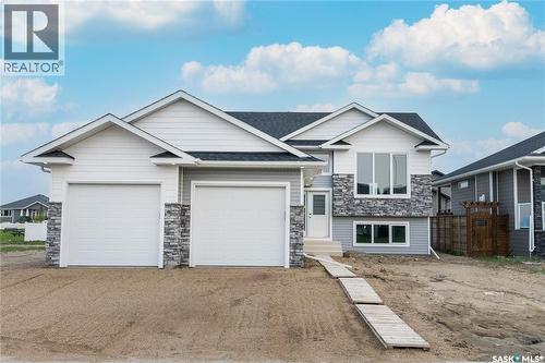 836 Woods Crescent, Warman, SK - Outdoor With Facade