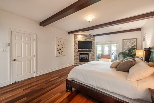 Master Bedroom - 349 Rue Montclair, Rosemère, QC - Indoor Photo Showing Bedroom With Fireplace
