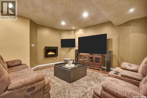 214 Burke Place, Warman, SK - Indoor Photo Showing Basement With Fireplace