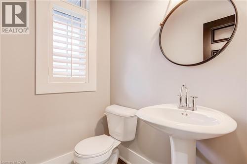 Bathroom with toilet and baseboards - 239 Cranbrook Street, Kitchener, ON - Indoor Photo Showing Bathroom
