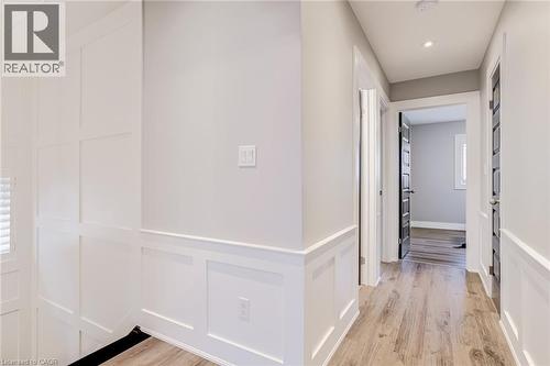 Hallway with light wood-style flooring, recessed lighting, and a decorative wall - 239 Cranbrook Street, Kitchener, ON - Indoor Photo Showing Other Room