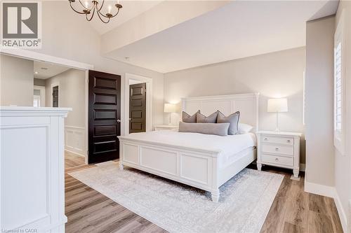 Bedroom featuring light wood-style floors and hanging lights - 239 Cranbrook Street, Kitchener, ON - Indoor Photo Showing Bedroom