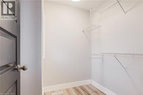 Walk in closet with light wood finished floors - 239 Cranbrook Street, Kitchener, ON - Indoor With Storage