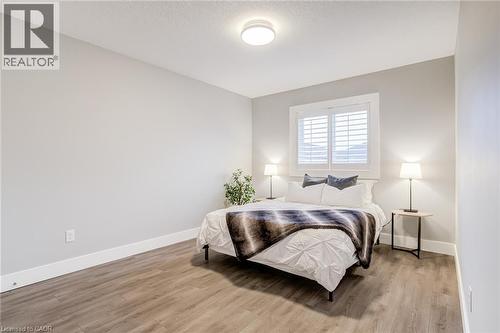 Bedroom featuring light wood-style floors and a textured ceiling - 239 Cranbrook Street, Kitchener, ON - Indoor Photo Showing Bedroom