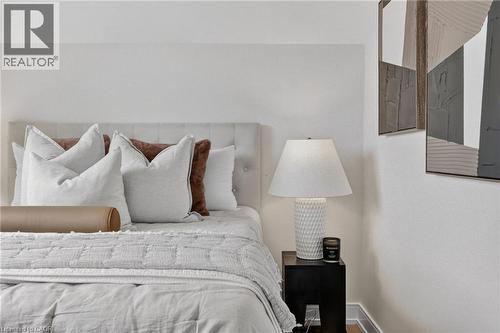 Upholstered headboard with button tufting - 174 London Street N, Hamilton, ON - Indoor Photo Showing Bedroom