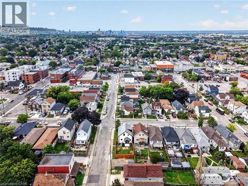 Urban neighborhood with a diverse architectural mix, mature trees, and distant city skyline - 174 London Street N, Hamilton, ON - Outdoor With View