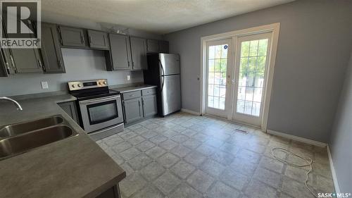 1715 Fleet Street, Regina, SK - Indoor Photo Showing Kitchen With Double Sink