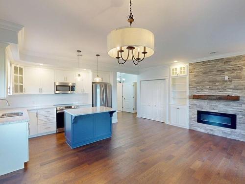 29 Bedwin Drive, Georges River, NS - Indoor Photo Showing Kitchen With Fireplace With Upgraded Kitchen