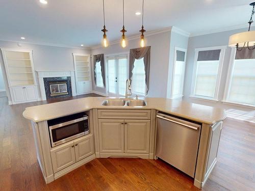 29 Bedwin Drive, Georges River, NS - Indoor Photo Showing Kitchen With Fireplace With Double Sink