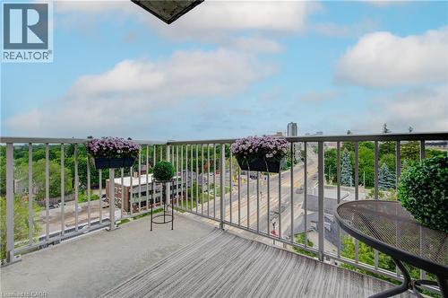 Concrete balcony with a light gray metal railing, offering broad urban and natural elements - 191 King Street S Unit# 607, Waterloo, ON - Outdoor With Balcony With View