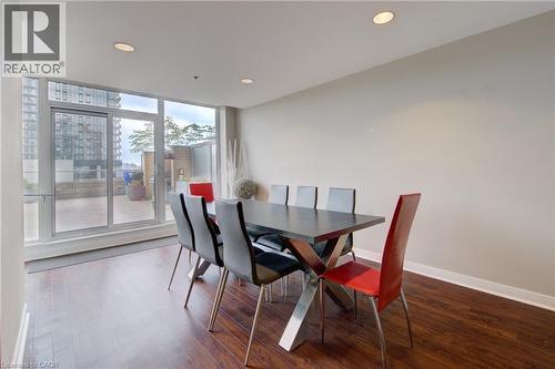 Building  Party Room ,Dining space featuring rich wood-finish flooring and recessed lighting - 191 King Street S Unit# 607, Waterloo, ON - Indoor Photo Showing Dining Room