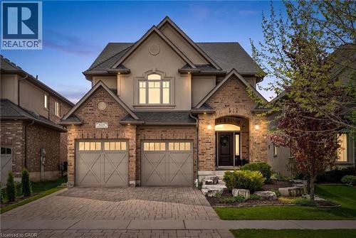 Traditional-style facade featuring brick and stucco elements. - 828 Copper Ridge Drive, Waterloo, ON - Outdoor