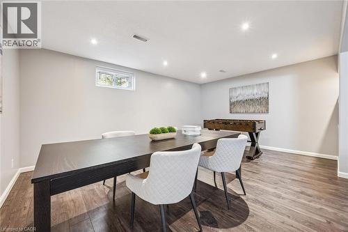 Spacious lower level living area featuring wood-finish flooring, recessed lighting, and light-toned walls - 828 Copper Ridge Drive, Waterloo, ON - Indoor