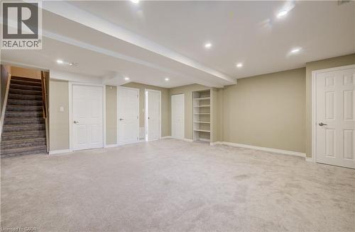 Spacious lower-level room featuring light gray carpeting and recessed lighting - 80 Miranda Path, Elmira, ON - Indoor Photo Showing Basement