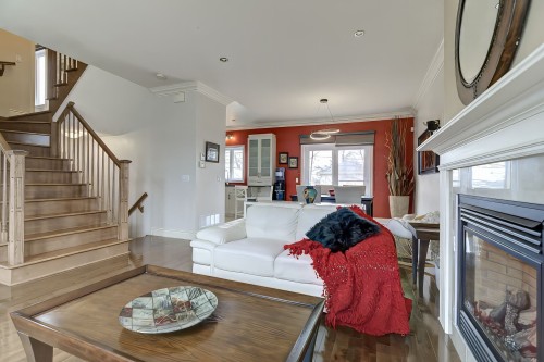 Vue d'ensemble - 8821 Place Rhoda, Brossard, QC - Indoor Photo Showing Living Room With Fireplace