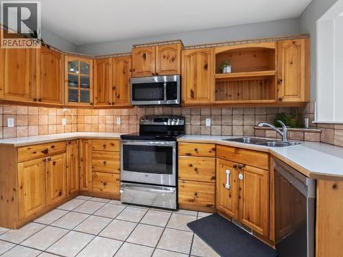 27 12Th Avenue, Whitehorse, YT - Indoor Photo Showing Kitchen With Double Sink