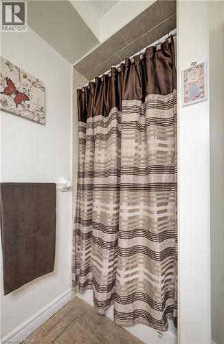Tiled shower surround with a fabric shower curtain - 16 Steed Court, Brantford, ON 
