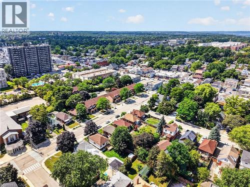 Residential neighborhood featuring detached homes and multi-story apartment buildings - 43 E Brucedale Avenue E, Hamilton, ON 