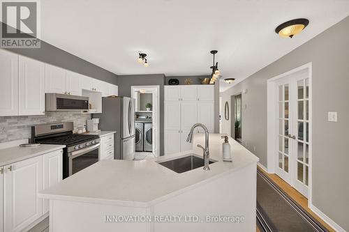 Open concept kitchen with stainless appliances - 2545 Page Road, Ottawa, ON 