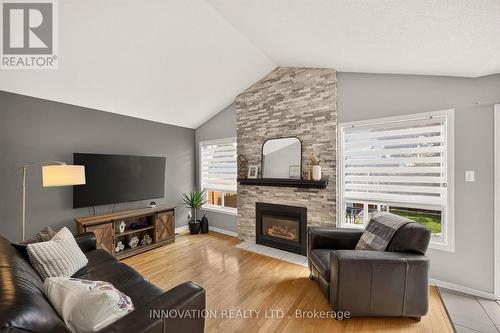 Family room with gas fireplace & cathedral ceiling - 2545 Page Road, Ottawa, ON 