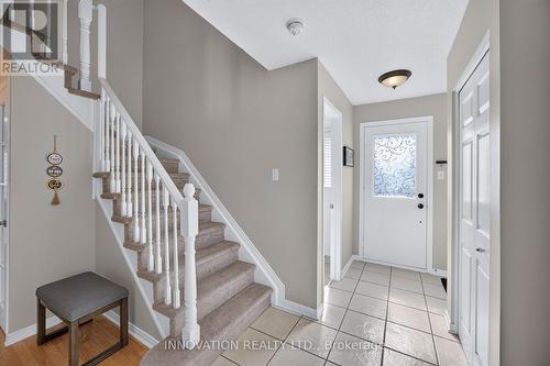 Foyer with view of side entrance & 2 pc. washroom - 2545 Page Road, Ottawa, ON 